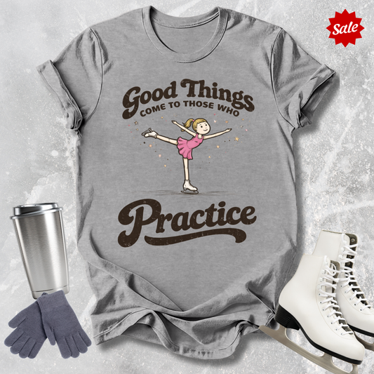 Gray t-shirt with a graphic of a dancer and text 'Good Things Come to Those Who Practice', placed on a textured surface with a sale label.