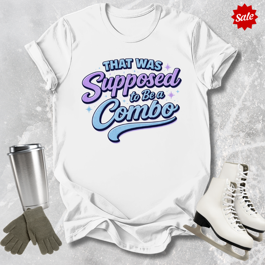 White t-shirt with colorful figure skating that was supposed to be a combo text, silver tumbler, gray gloves, and white skates on a light gray background.
