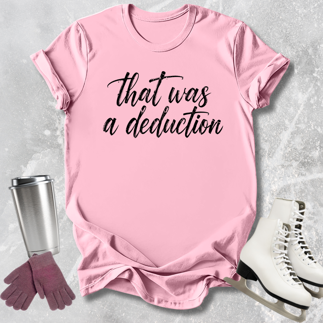 Pink t-shirt with 'That was a deduction' text, next to a silver tumbler, pink gloves, and white skates on a gray textured background.