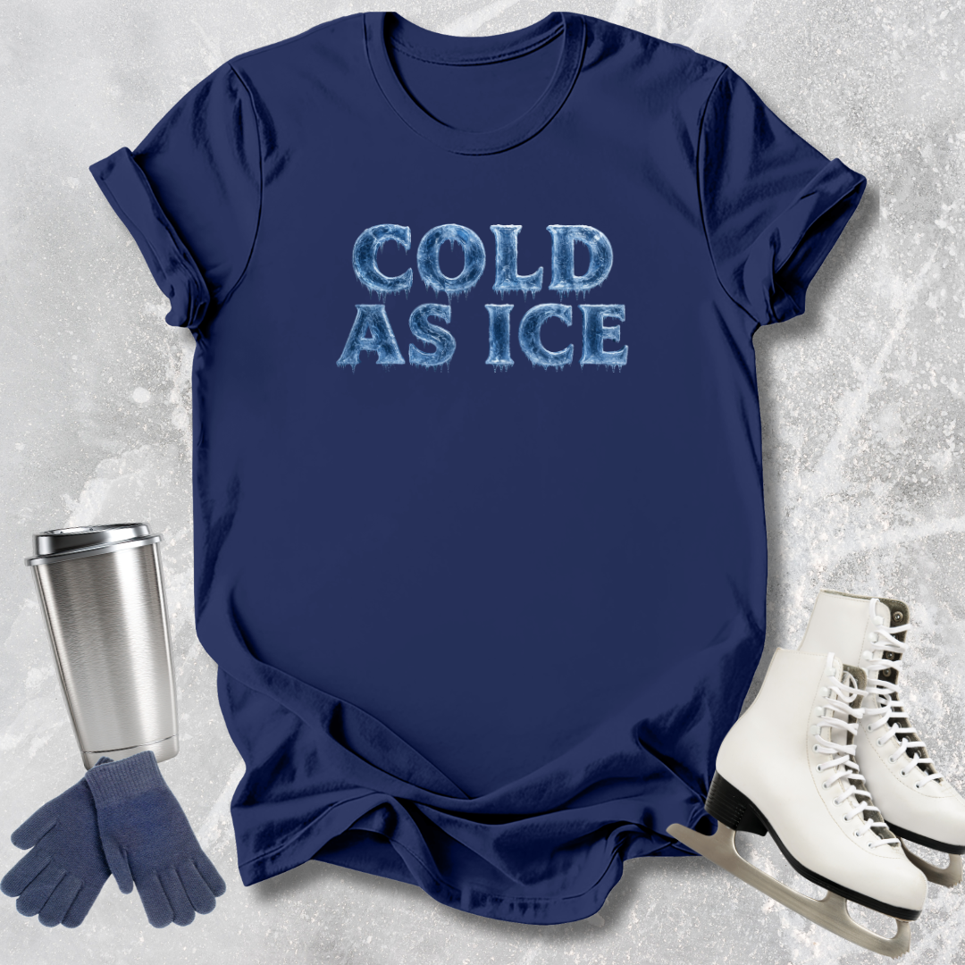 Navy blue t-shirt with 'COLD AS ICE' text, silver tumbler, brown gloves, and white skates on a textured gray background