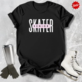 Black t-shirt with 'SKATER SENIOR' text, surrounded by ice skates and a tumbler on a textured gray background.