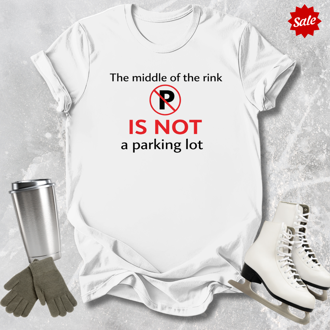 White t-shirt with humorous text design, surrounded by ice skates, gloves, and a tumbler on an ice rink background.