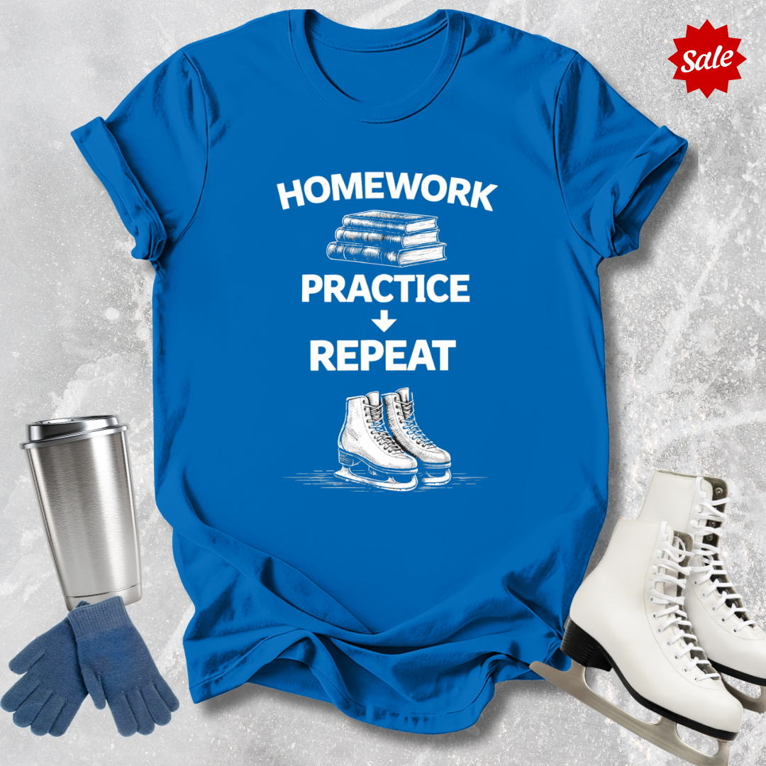 Blue t-shirt with 'Homework, practice, repeat' text, next to a silver tumbler, black gloves, and white figure skates on a textured gray background.