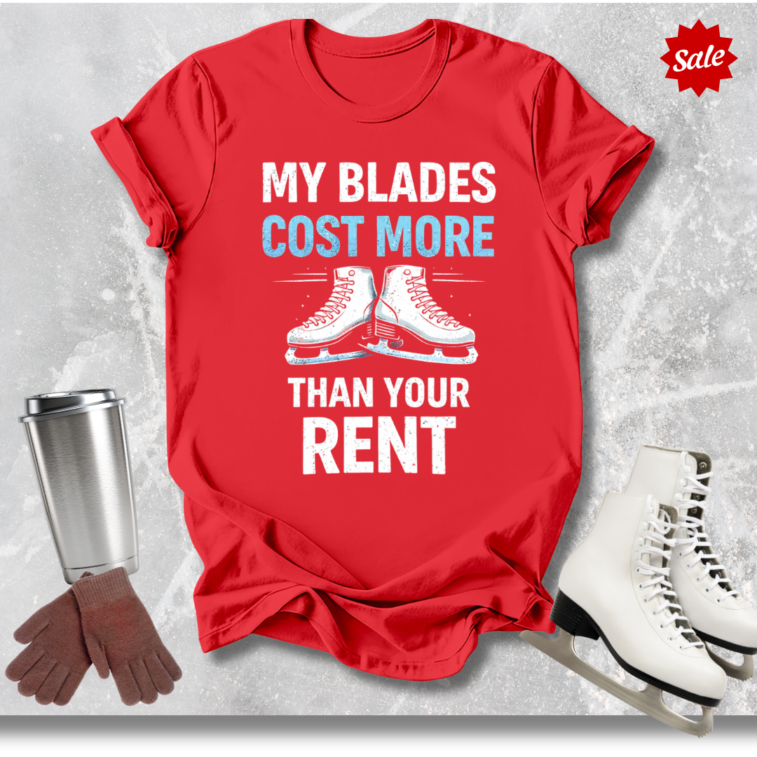 Red t-shirt with 'MY BLADES COST MORE THAN YOUR RENT' text, next to a silver tumbler, black gloves, and white figure skates on a textured gray background.