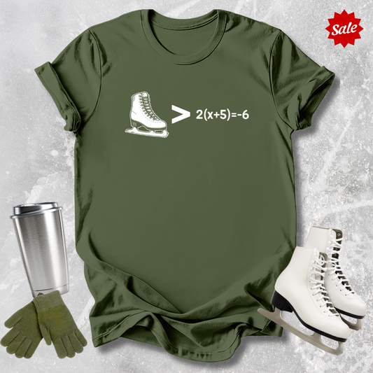 Green t-shirt with ice skate graphic and math equation, next to white skates, silver tumbler, and green gloves on a textured gray background.