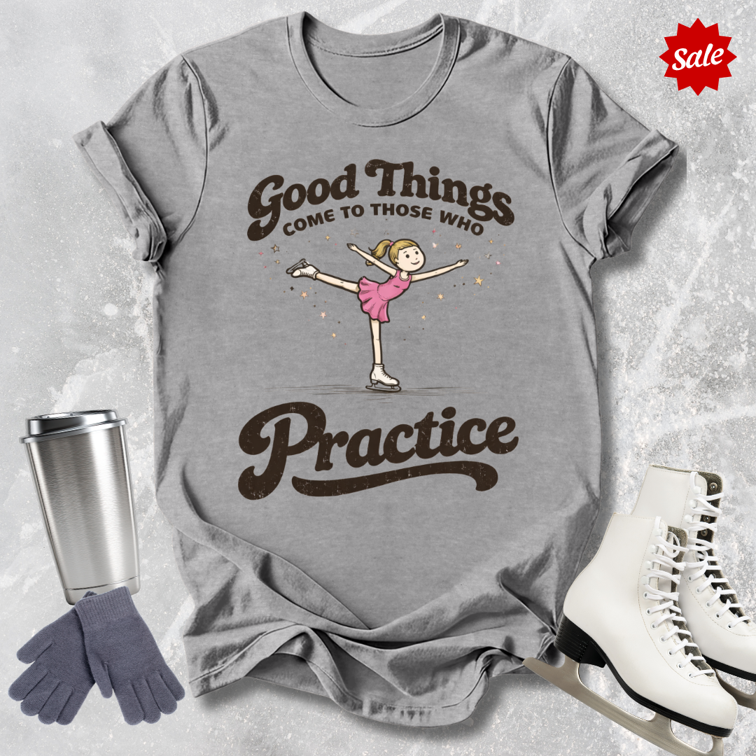Gray t-shirt with a graphic of a dancer and text 'Good Things Come to Those Who Practice', placed on a textured surface with a sale label.