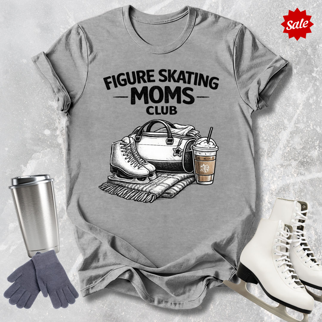 Gray t-shirt with 'Figure Skating Moms Club' graphic, surrounded by ice skates, gloves, and a coffee cup on a textured gray background.