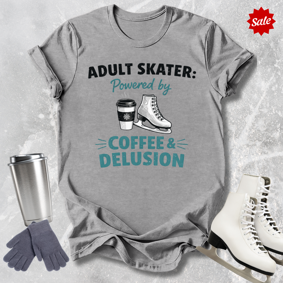 Gray t-shirt with 'Adult Skater' graphic, coffee cup, skates, and gloves on a textured gray background.