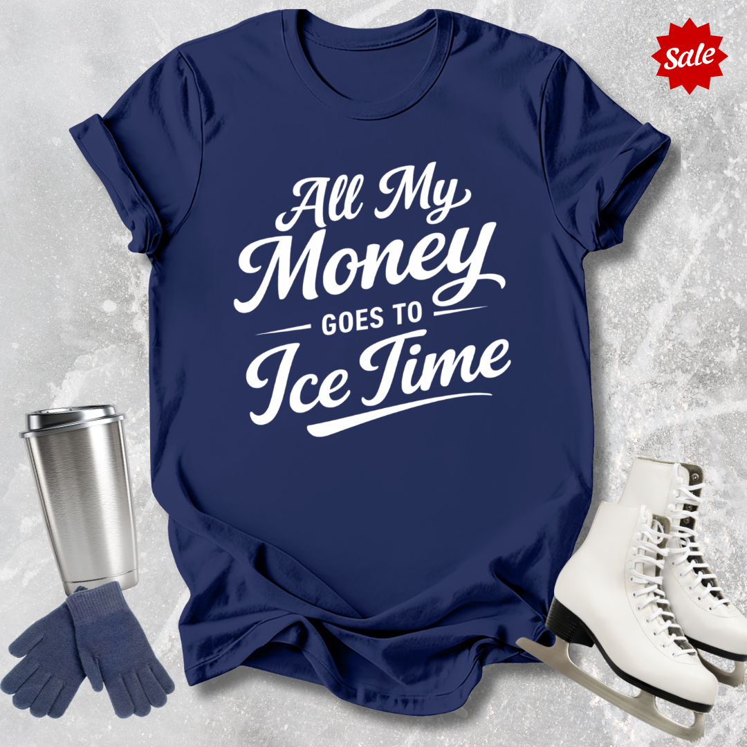 Navy blue t-shirt with 'All My Money Goes to Ice Time' text, next to a silver tumbler, gloves, and skates on a textured gray background.