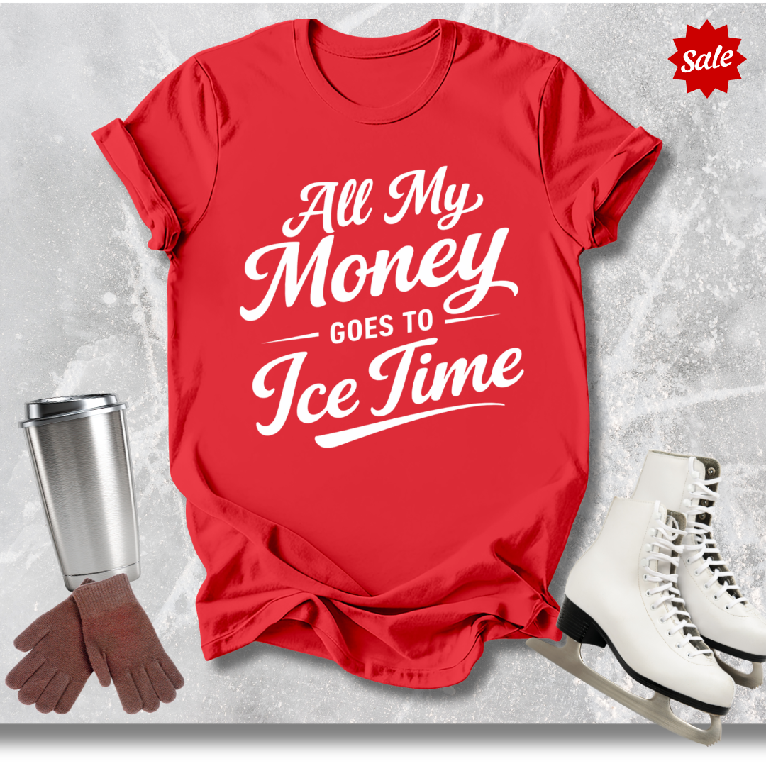 Red t-shirt with 'All My Money Goes to Ice Time' text, next to a silver tumbler, brown gloves, and white skates on a gray background.