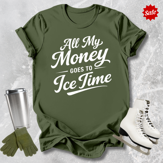 Green t-shirt with 'All My Money Goes to Ice Time' text, paired with a silver tumbler, green gloves, and white skates on a textured gray background.