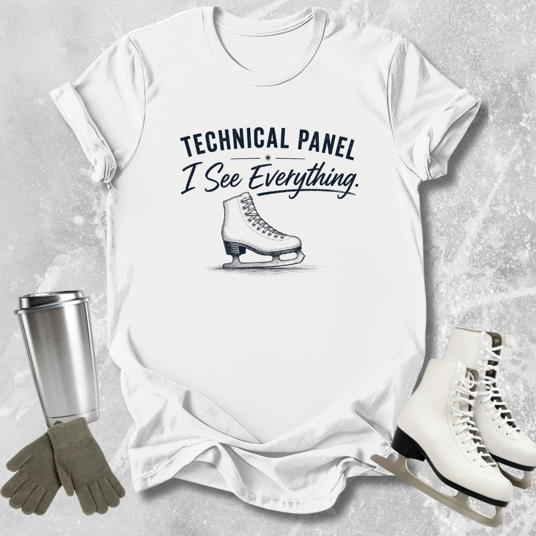 White t-shirt with 'Technical Panel I See Everything' text and ice skate graphic, surrounded by ice skates and a tumbler.