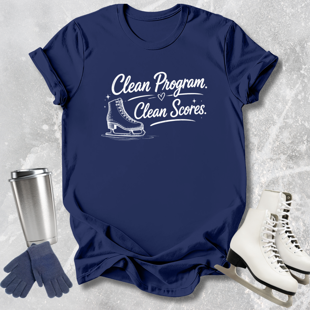 Navy blue t-shirt with 'Clean Program, Clean Scores' text and ice skate graphic on a textured gray background.