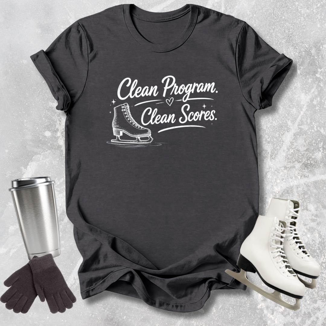 Black t-shirt with 'Clean Program, Clean Scores' text and ice skate graphic, surrounded by ice skates and a tumbler.