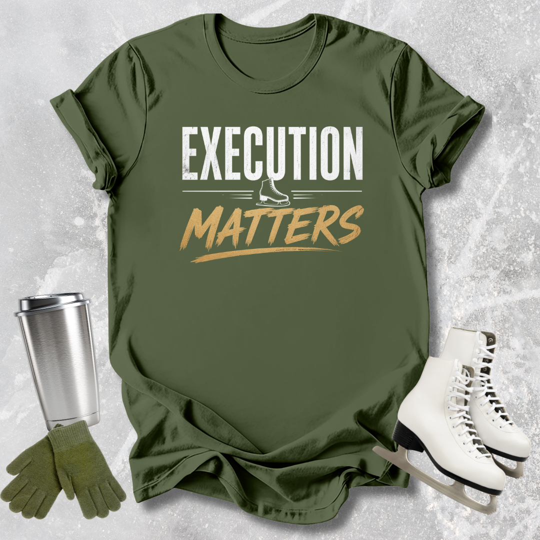 Green t-shirt with 'Execution Matters' text, paired with a silver tumbler, green gloves, and white boots on a textured gray background.