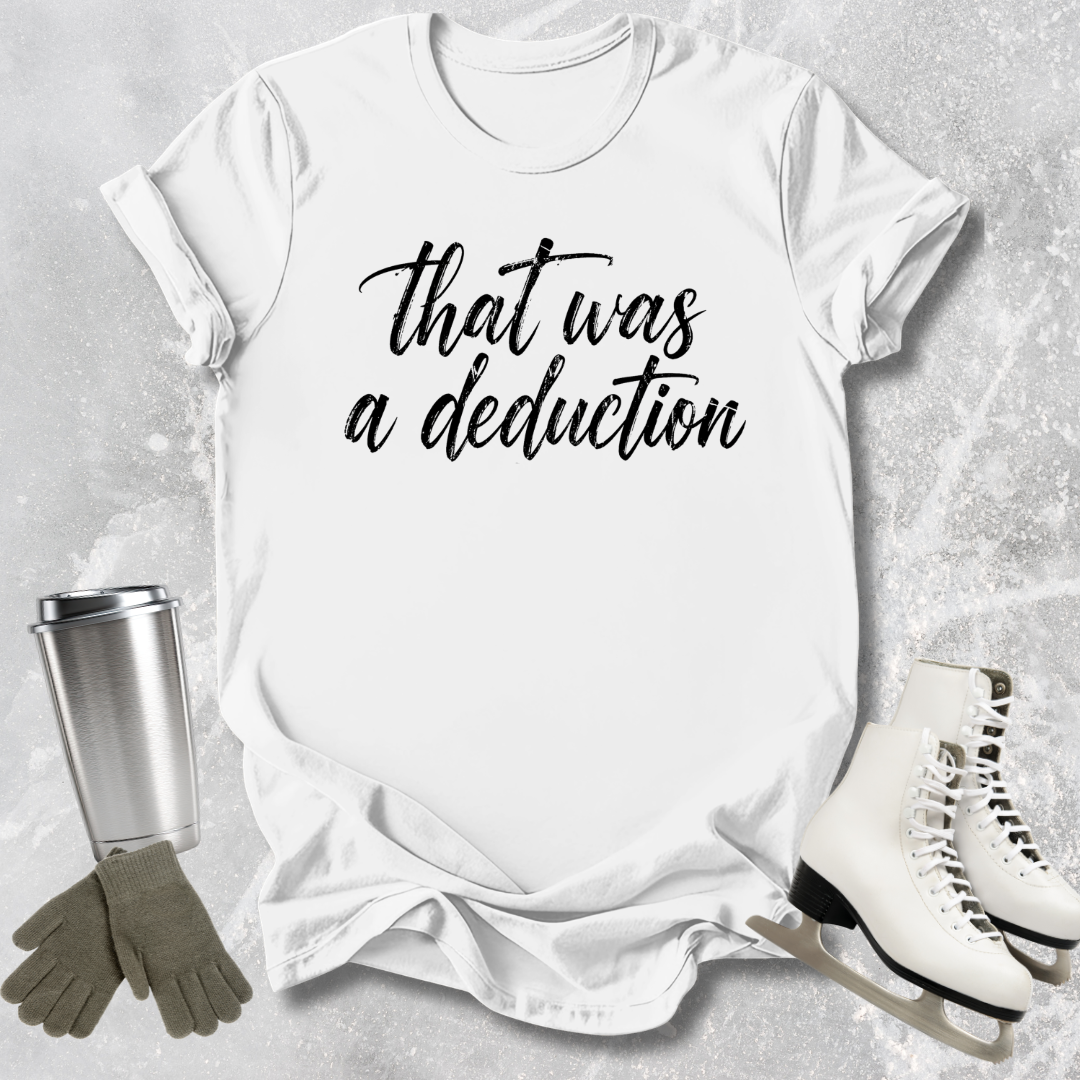 White t-shirt with 'That was a deduction' text, next to a silver tumbler, green gloves, and white skates on a gray textured background.