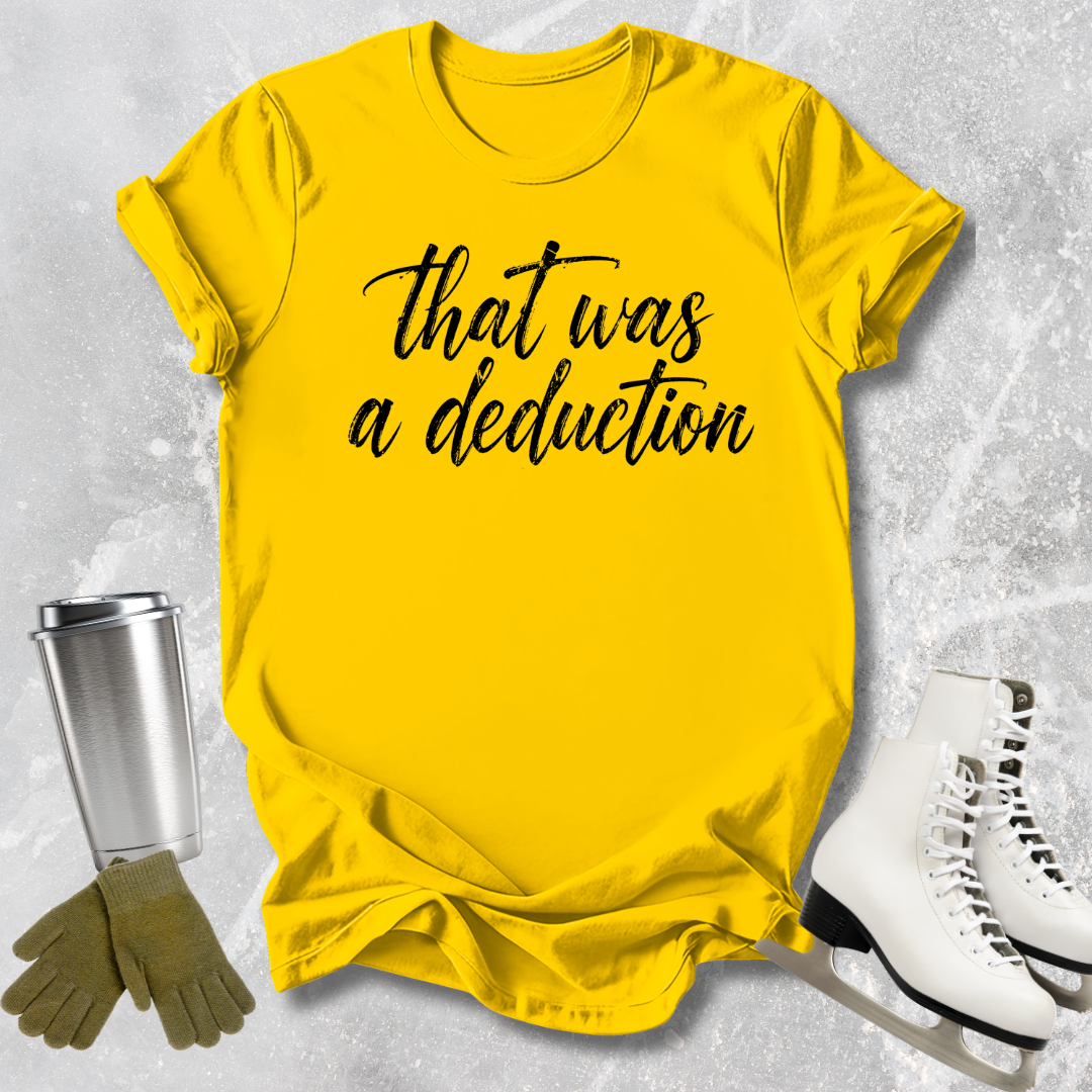 Yellow t-shirt with 'That was a deduction' text, next to a silver tumbler, green gloves, and white skates on a textured gray background.