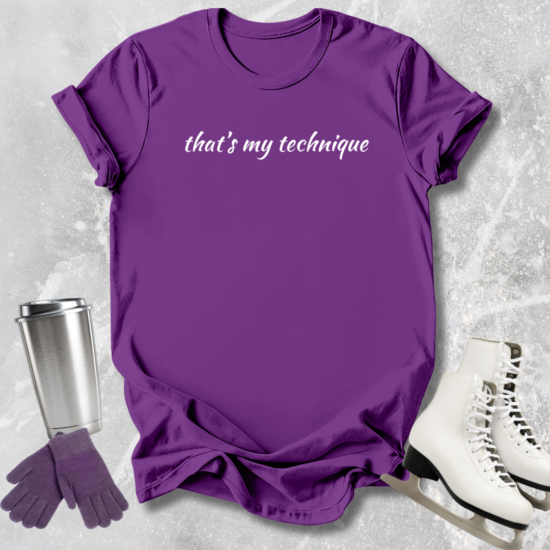 Purple t-shirt with 'that's my technique' text, silver tumbler, purple gloves, and white skates on a textured gray background