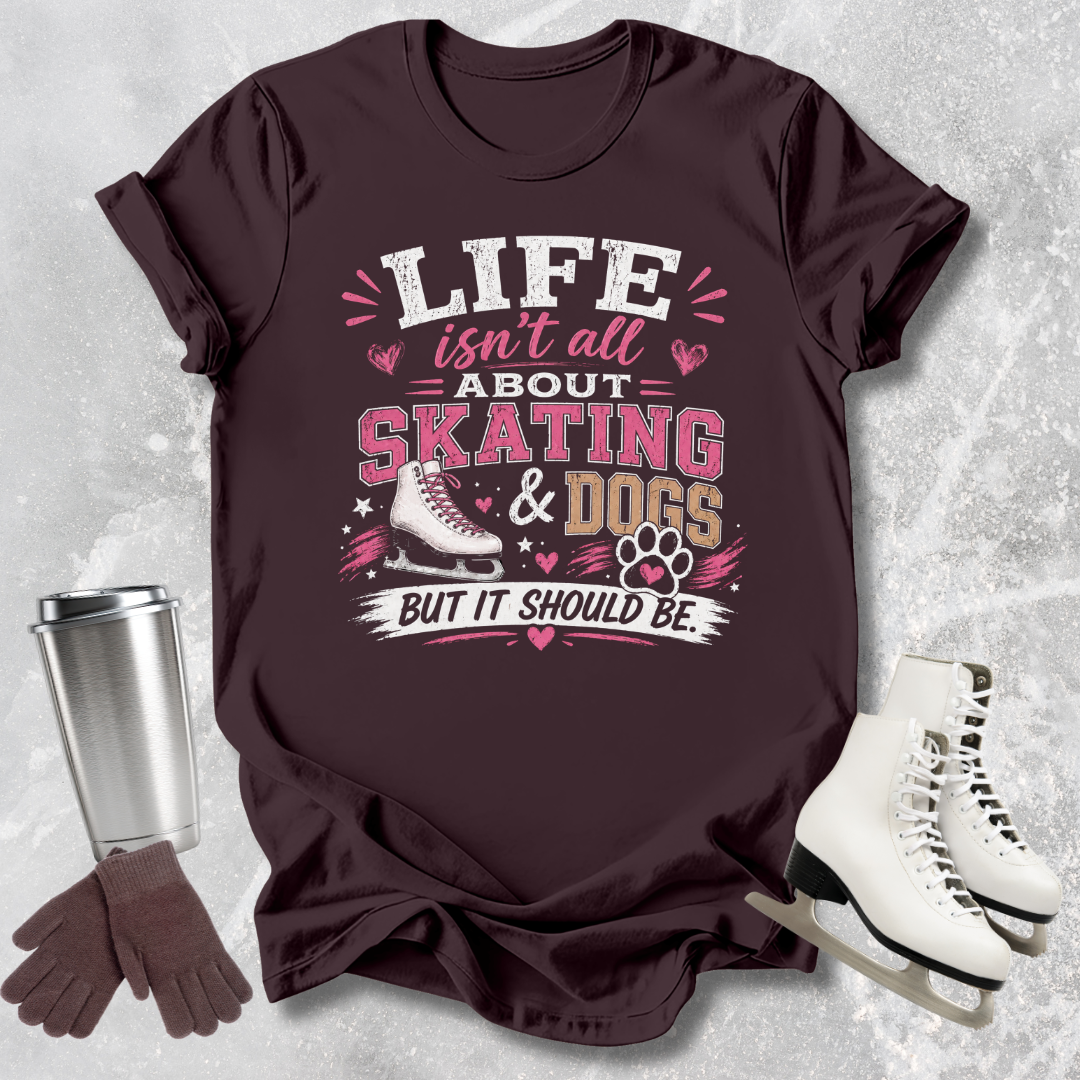 Maroon t-shirt t-shirt with 'Life isn't all about skating & dogs but it should be' text and graphics on a textured gray background.