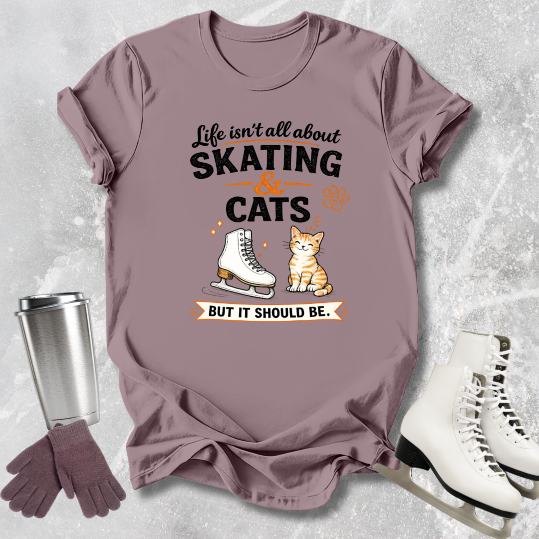Mauve t-shirt with skating and cats graphic on a textured gray background