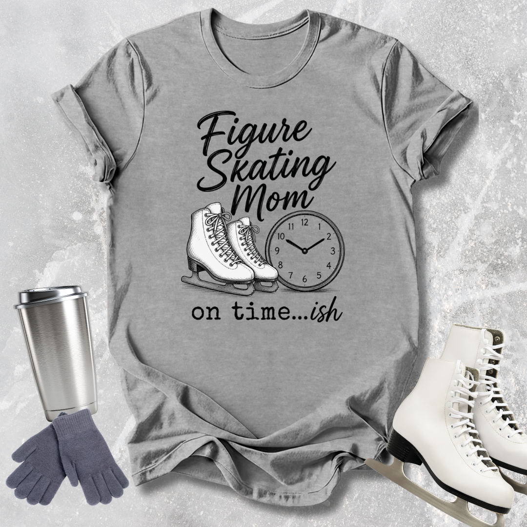 Gray t-shirt with figure skating mom graphic and accessories on a textured surface
