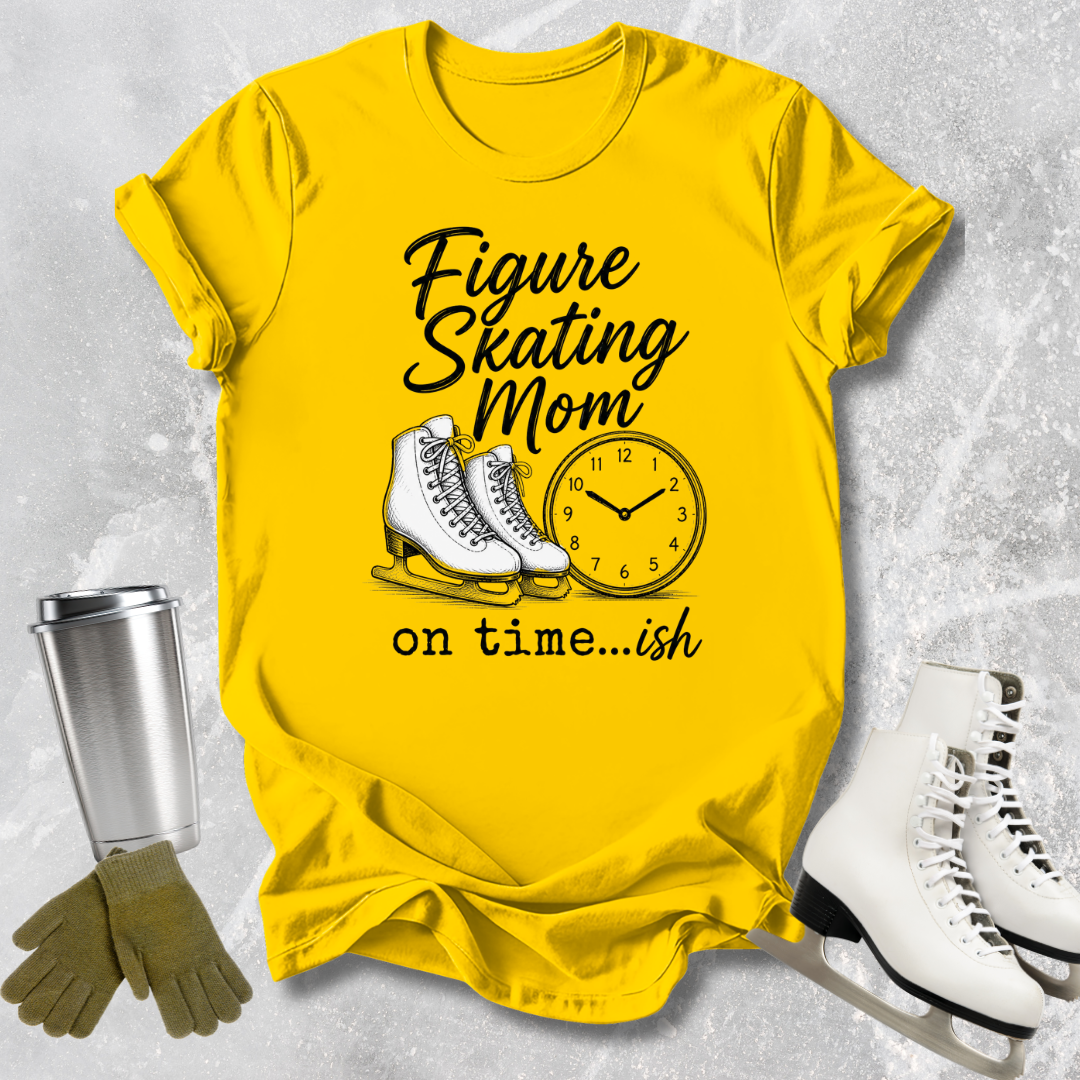 Yellow t-shirt with figure skating design and accessories on a textured gray background