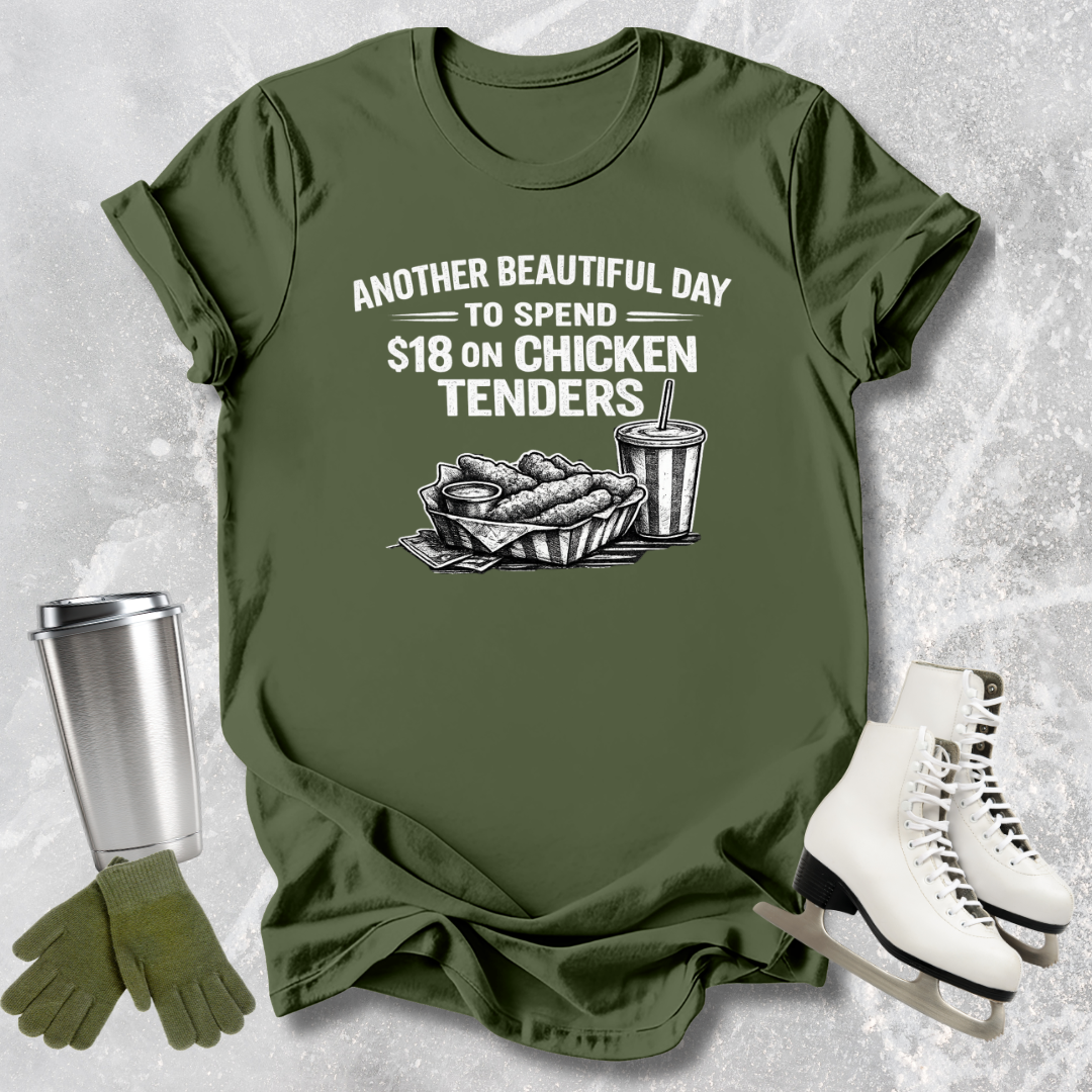 Green t-shirt with graphic and text on a textured surface with accessories.