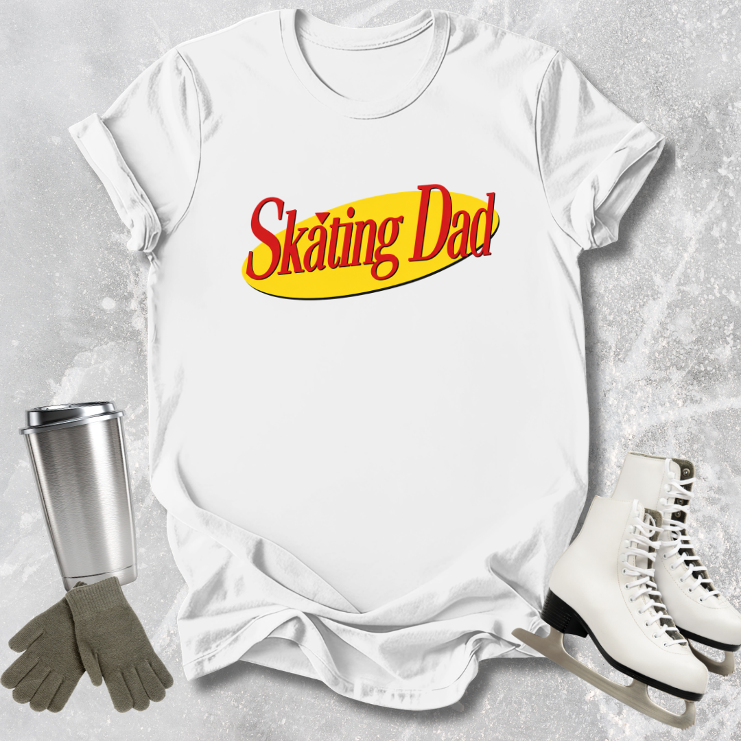 White t-shirt with 'Skating Dad' text, silver tumbler, gray gloves, and white skates on a textured gray background