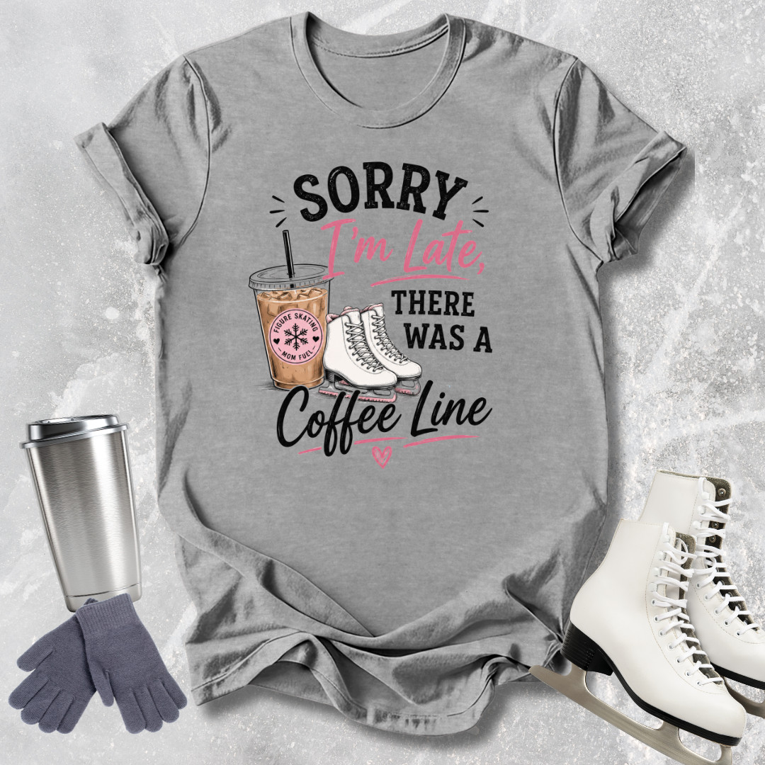 Gray t-shirt with coffee-themed graphic and accessories on a textured surface