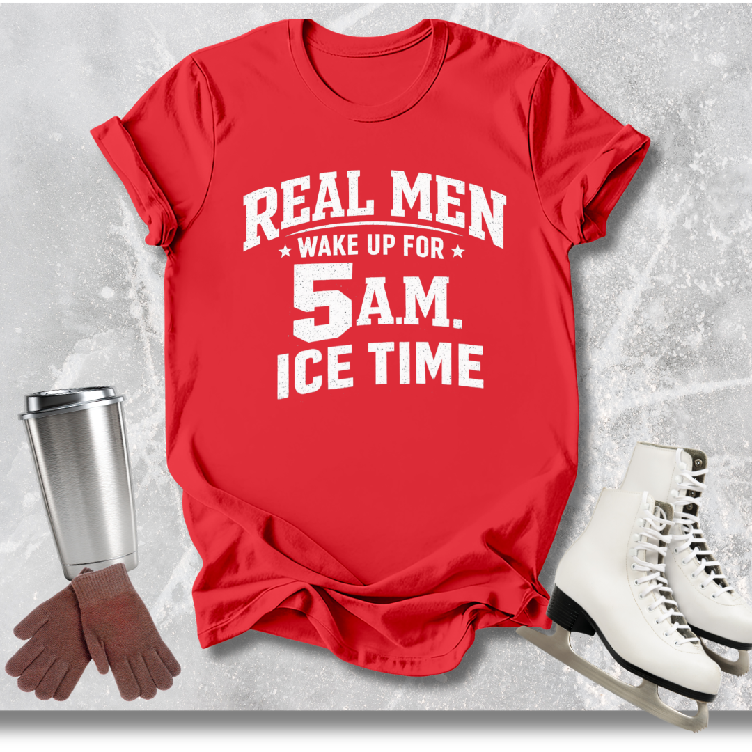 Red t-shirt with text 'Real men wake up for 5 a.m. Ice time' on a textured gray background with accessories.