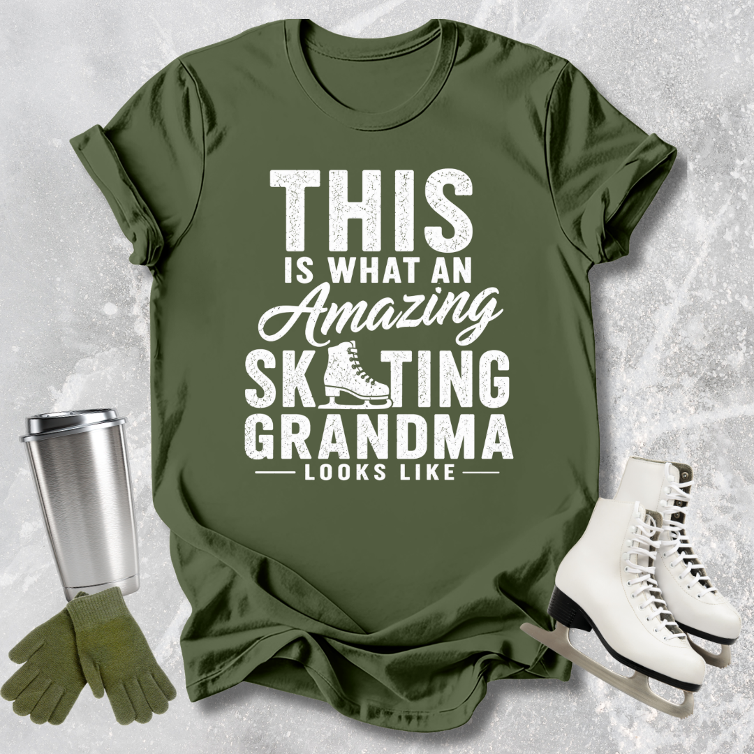 Green t-shirt with text 'This is what an amazing skating grandma looks like' on a textured surface with accessories.