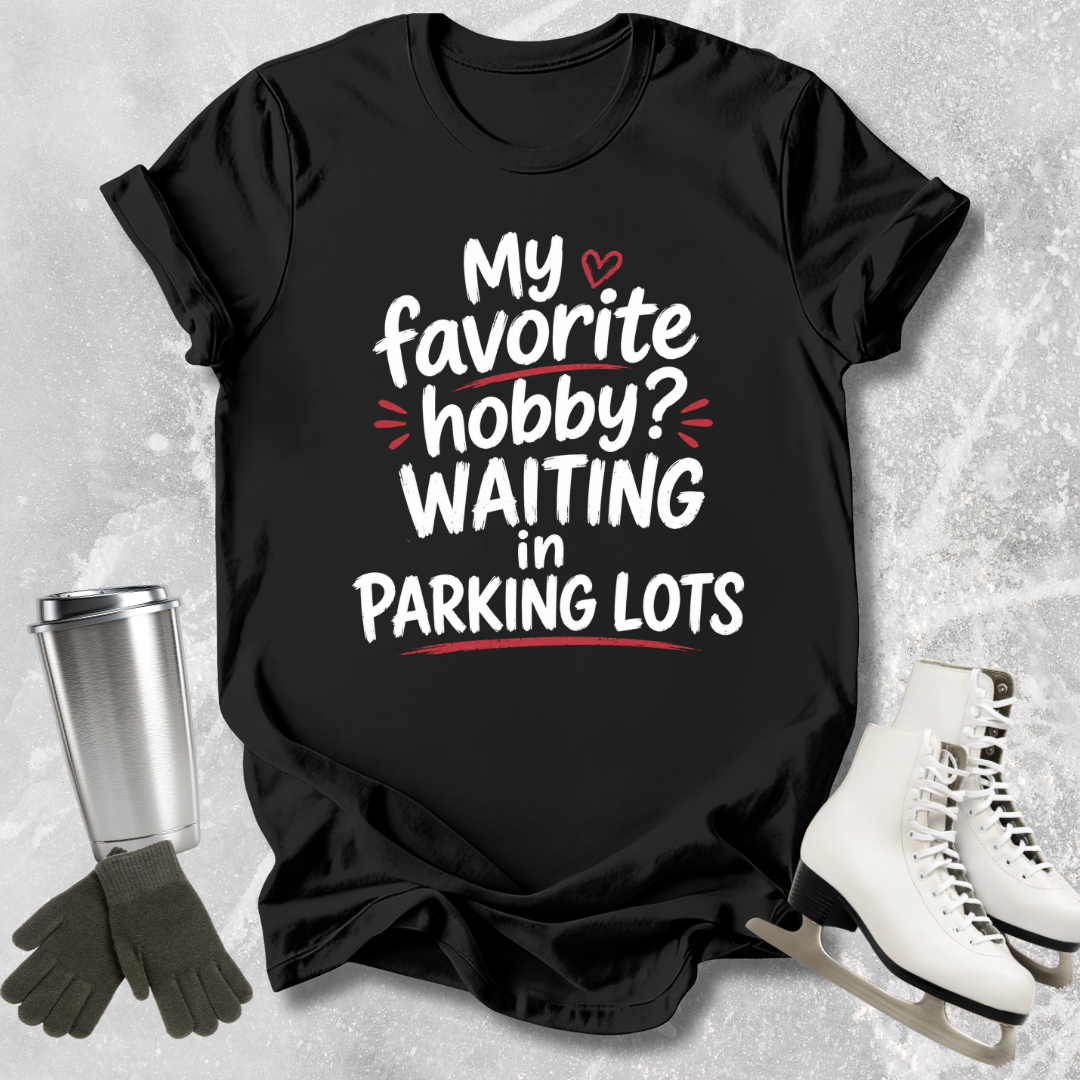 Black t-shirt with humorous text design on a textured surface with accessories.