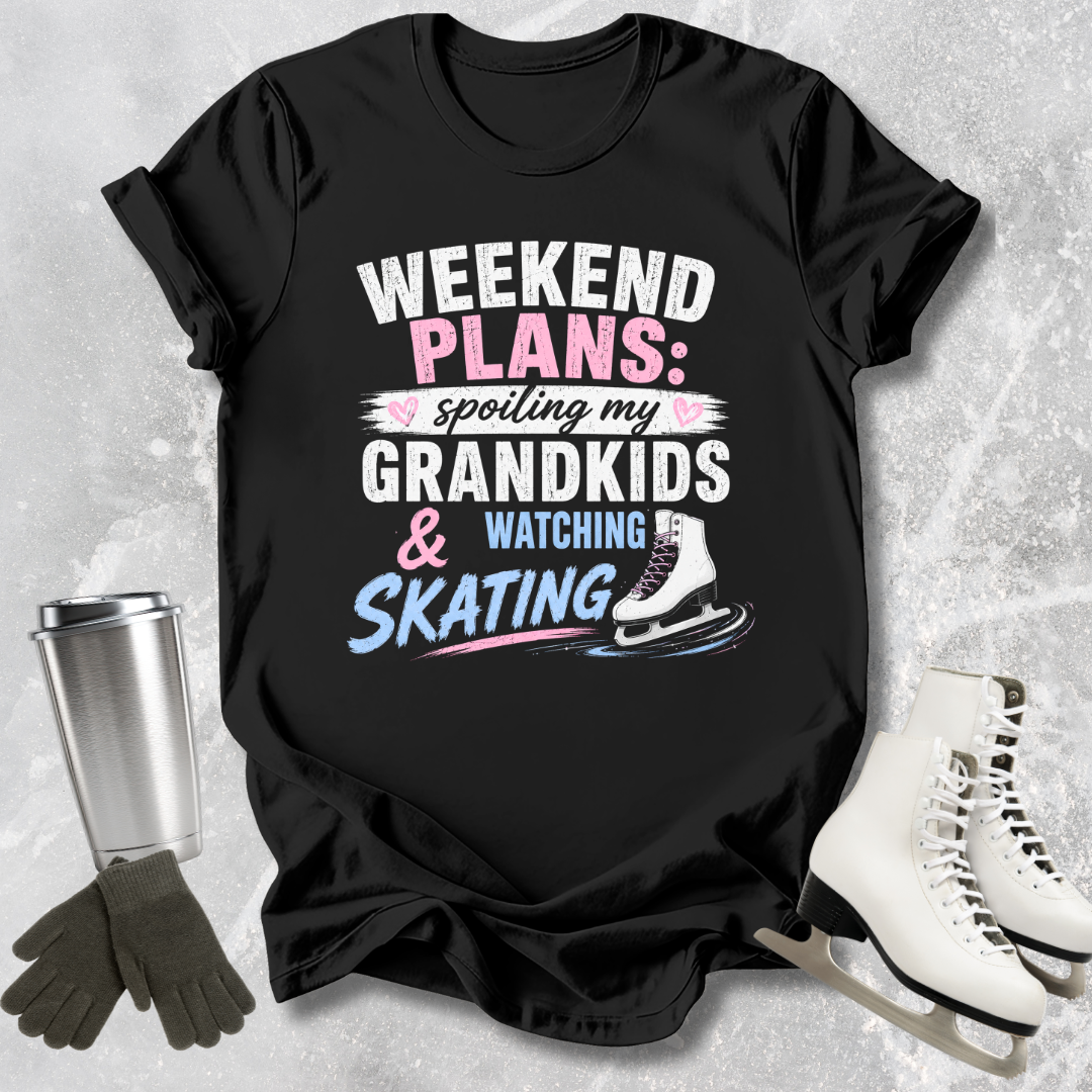 Black t-shirt with text 'Weekend Plans: spoiling my grandkids & watching skating' on a textured surface with accessories.