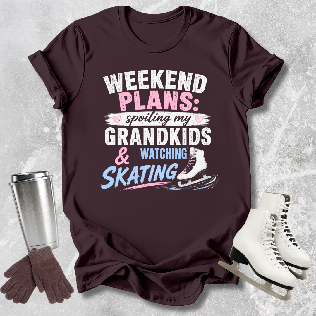 Maroon t-shirt with text 'Weekend Plans: spoiling my grandkids & watching skating' on a textured gray background.