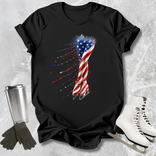 Black t-shirt with American flag design on a textured surface with accessories.