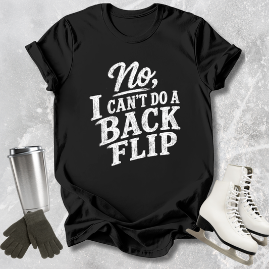 Black t-shirt with 'No, I can't do a back flip' text on a textured surface with ice skates and a tumbler.