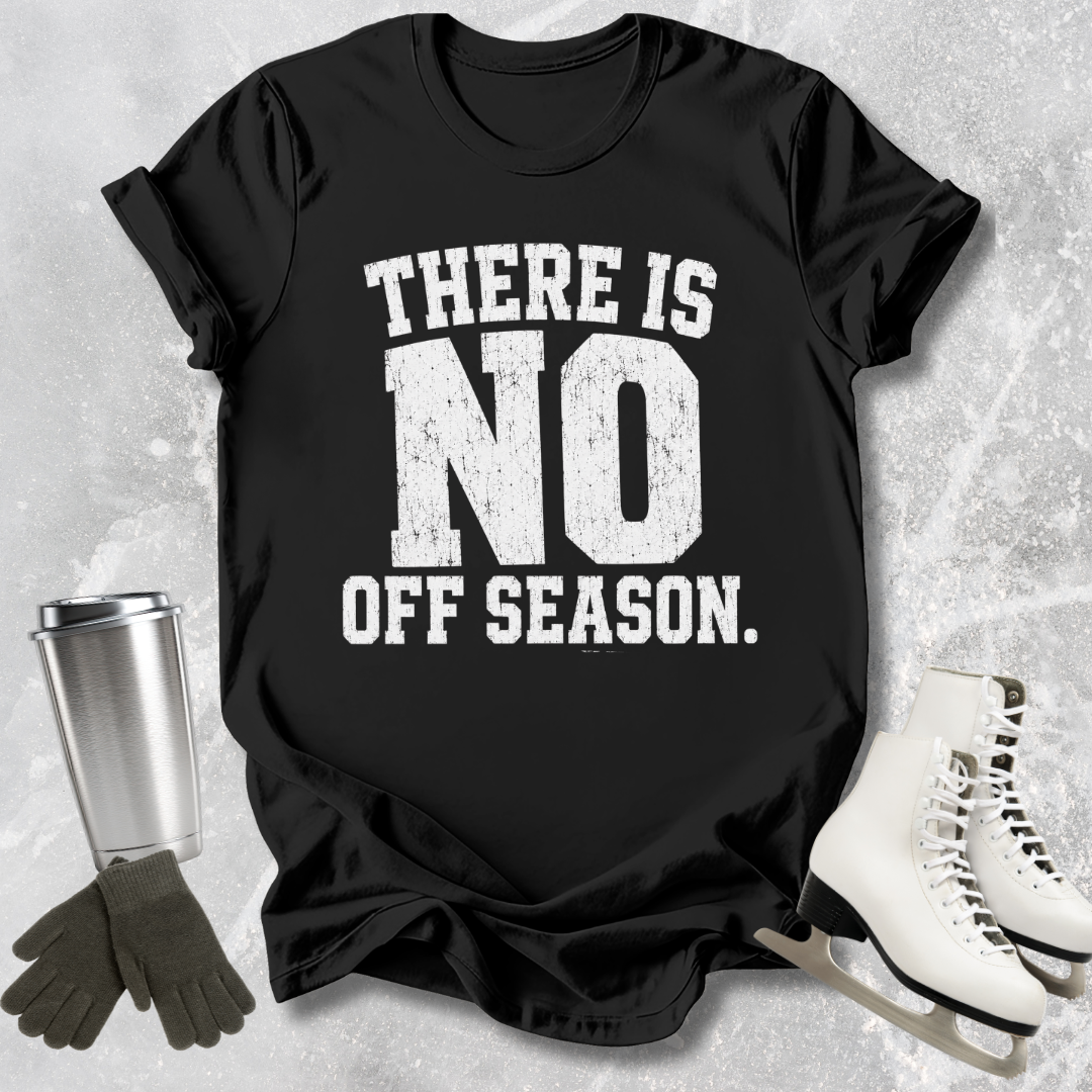 Black t-shirt with 'There is no off season' text, next to ice skates and a tumbler on a textured surface.