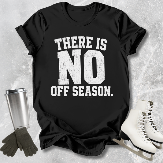 Black t-shirt with 'There is no off season' text, next to ice skates and a tumbler on a textured surface.
