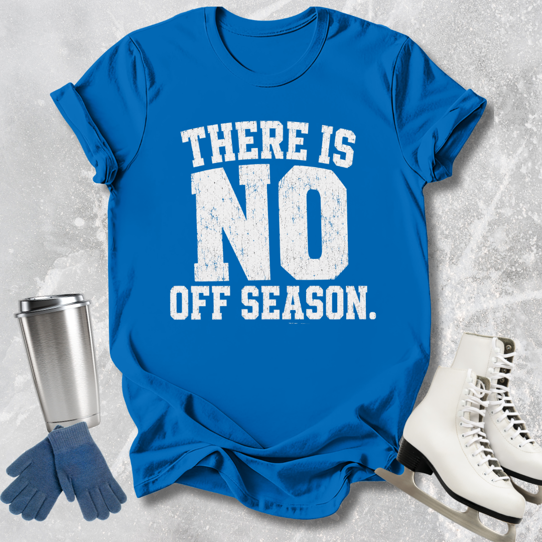 Blue t-shirt with 'There is no off season' text, next to a silver tumbler, blue gloves, and white skates on a textured gray background.
