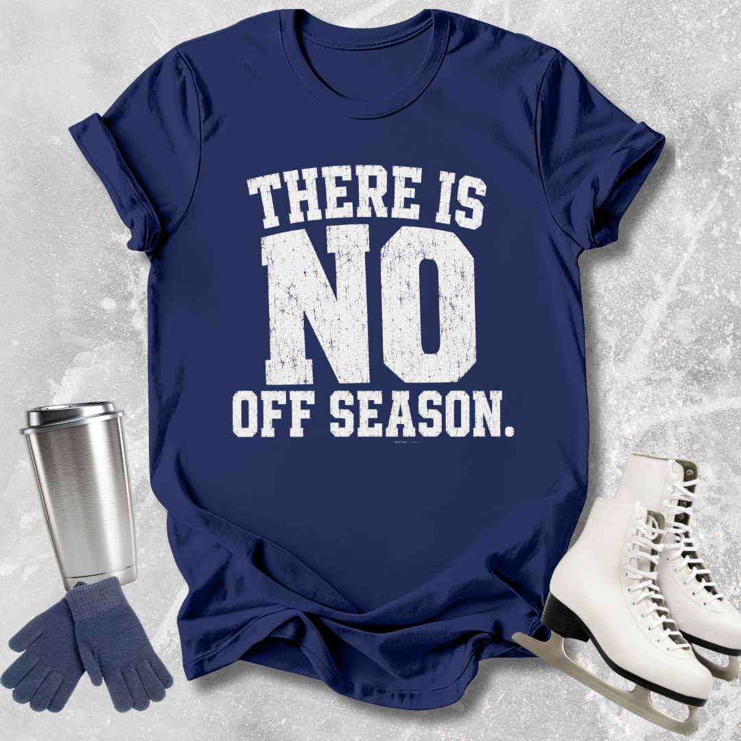 Navy blue t-shirt with 'There is no off season' text, next to a silver tumbler, gloves, and ice skates on a textured gray background.