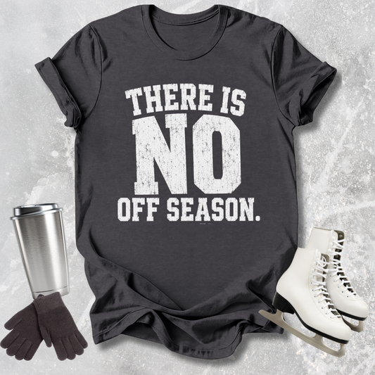 Black t-shirt with 'There is no off season' text, next to ice skates and a travel mug on a textured surface.