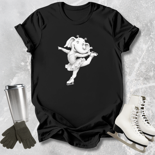 Black t-shirt with a white elephant graphic on a textured surface with accessories.