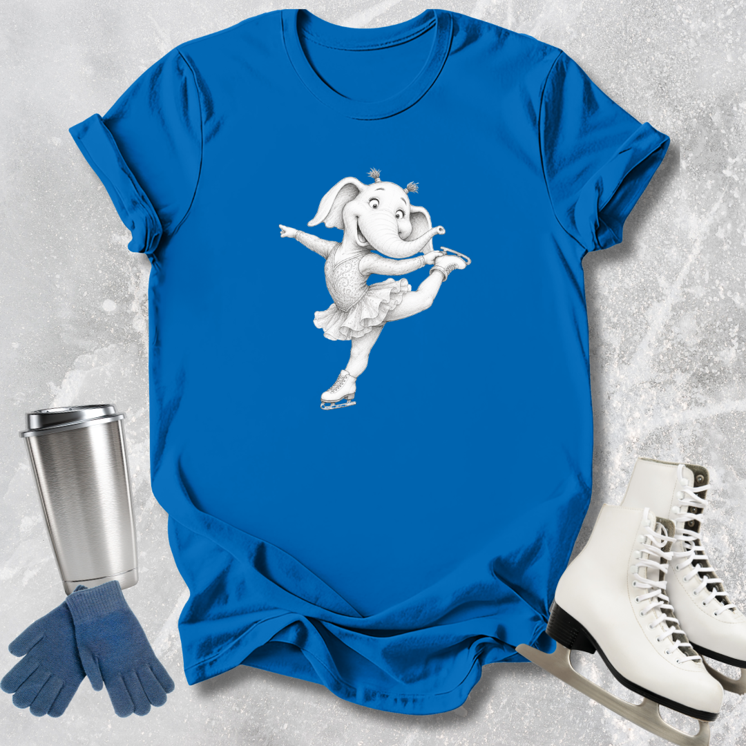 Blue t-shirt with a cartoon elephant design, next to a silver tumbler, blue gloves, and white ice skates on a textured gray background.