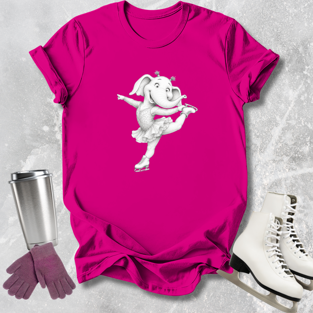 Pink t-shirt with a cartoon dog design, next to a silver tumbler, purple gloves, and white ice skates on a textured gray background.