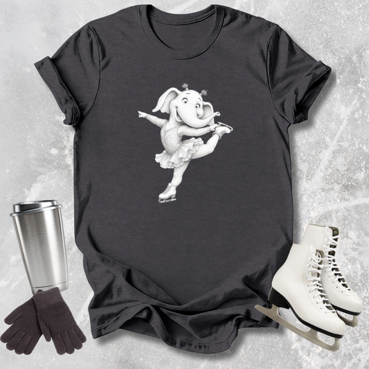 Black t-shirt with a cartoon elephant design, next to a silver tumbler, black gloves, and white skates on a textured surface.