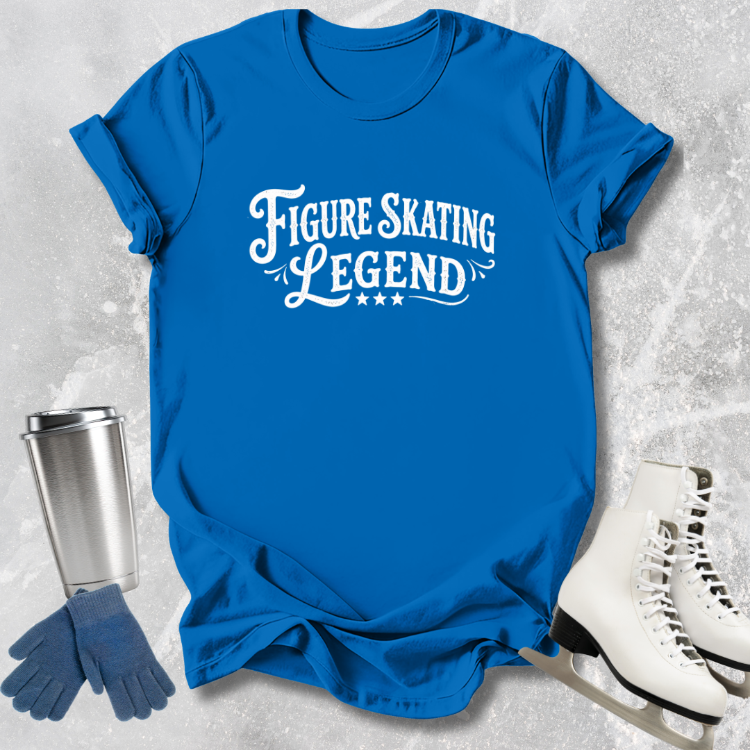 Blue t-shirt with 'Figure Skating Legend' text, silver tumbler, blue gloves, and white skates on a textured gray background.