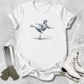 White t-shirt with a graphic design of a skater, next to white skates, gray gloves, and a silver tumbler on a textured surface.