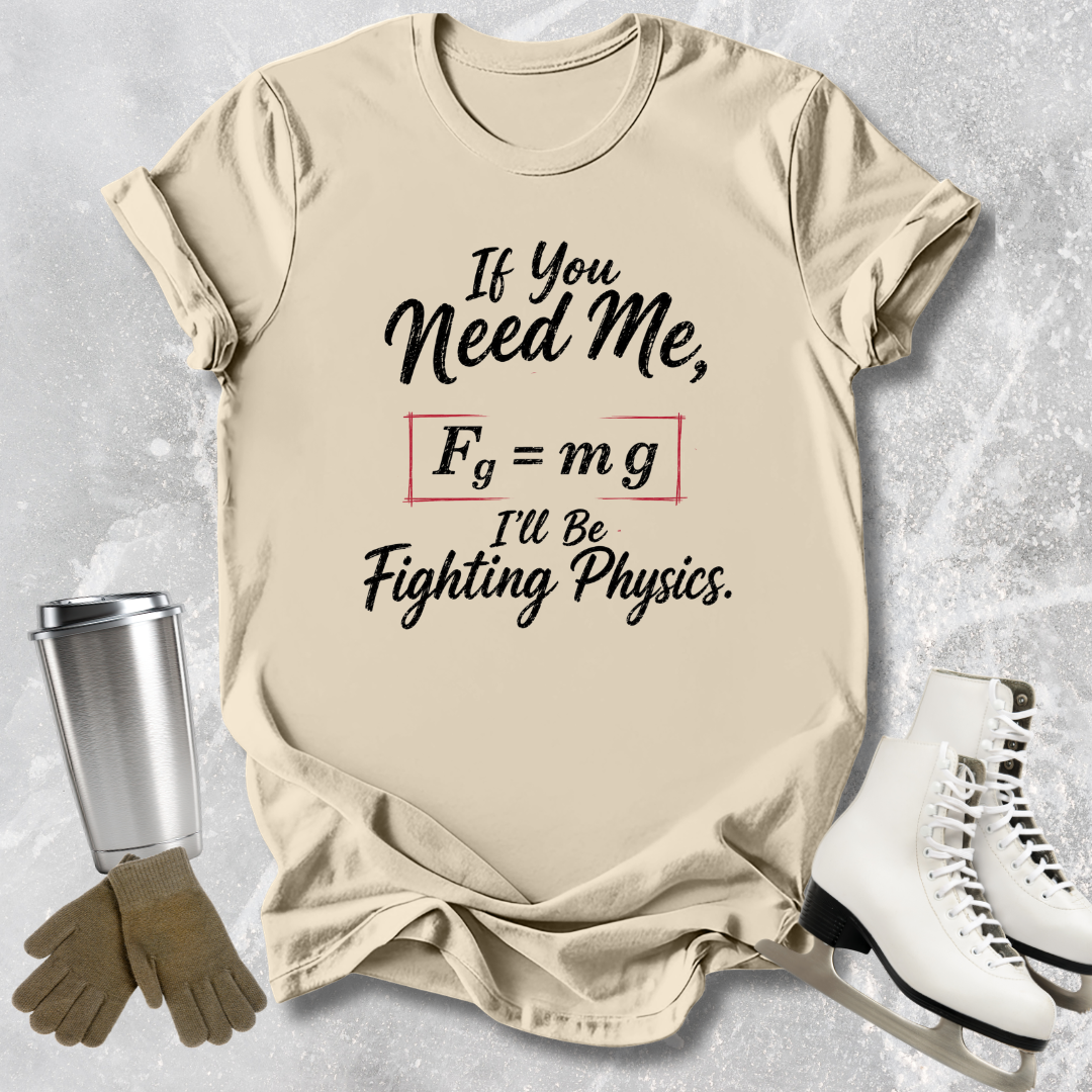 Beige t-shirt with physics-themed text, next to a silver tumbler, brown gloves, and white skates on a light gray background.