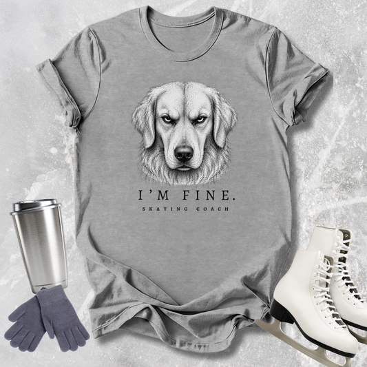 Gray t-shirt with a dog graphic and text, placed on a textured surface with a tumbler, gloves, and skates.
