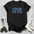 Black t-shirt with 'COLD AS ICE' text, silver tumbler, gloves, and skates on a textured gray background